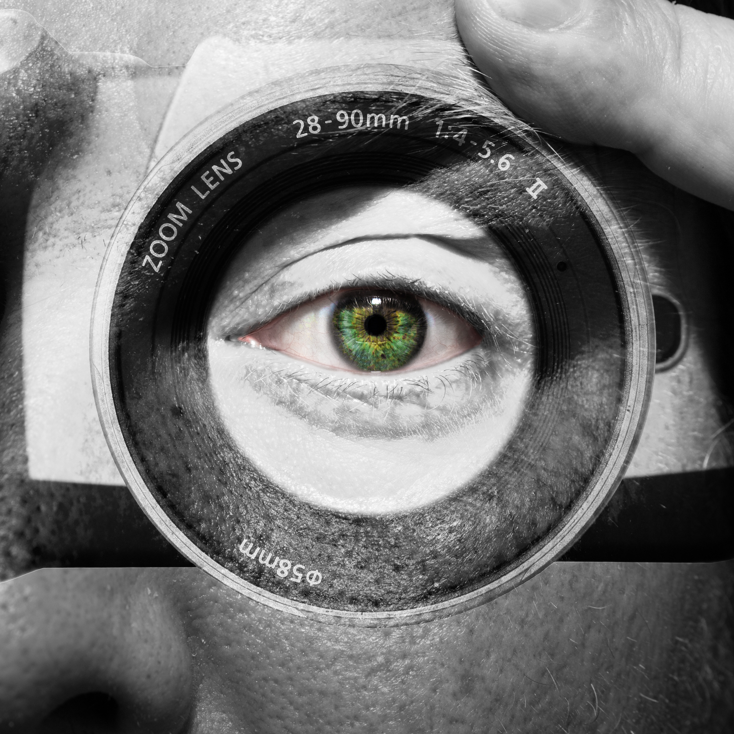 Camera painted on male face with green eyes